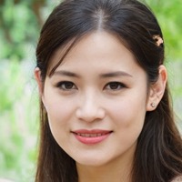 Smiling woman with long dark hair